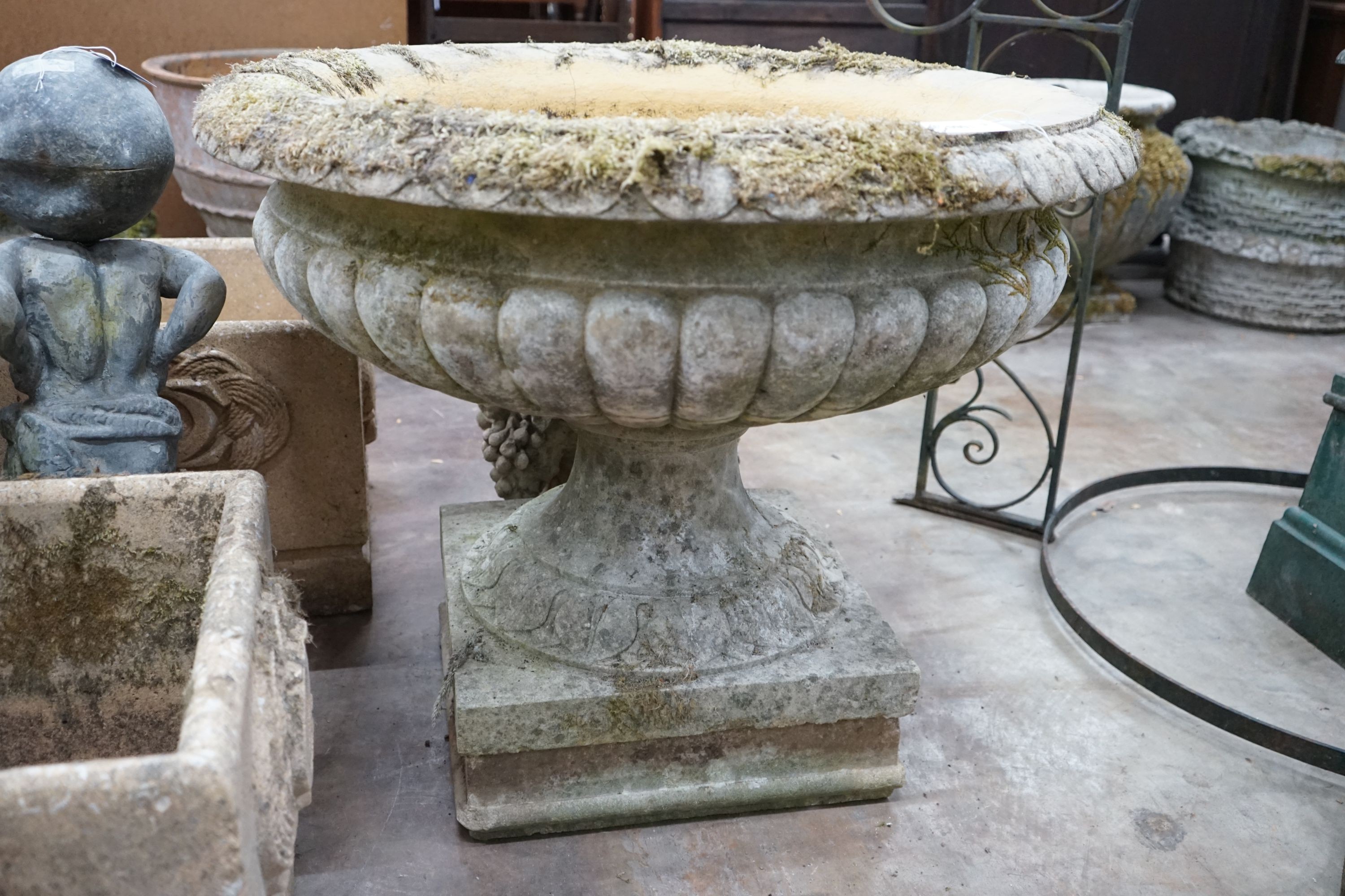 A large circular reconstituted stone campana garden urn, diameter 90cm, height 75cm